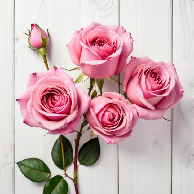 Foto fiori di rose rosa su uno sfondo di legno bianco buon valentino con una carta di auguri romantica