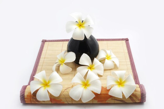 Flowers on place mat against white background