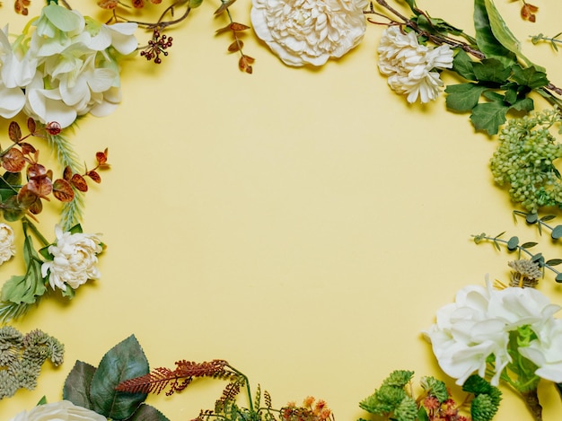 Flowers and plants on yellow background frame