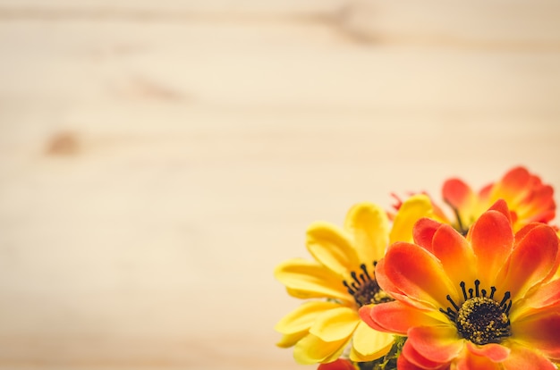 Flowers and pot on the office desk. Vintage tone