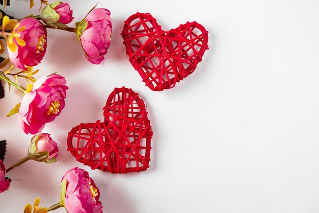 Flowers and red hearts on a white background for Valentines Day