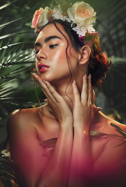 Flowers skincare and woman with rose crown in studio for beauty makeup and wellness with leaf nature and plant Flower girl and model in jungle for facial skin and cleaning floral and aesthetic