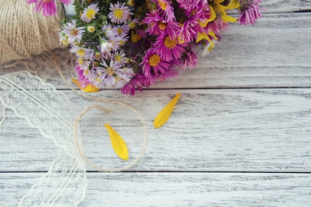 Flowers and a spool of thread