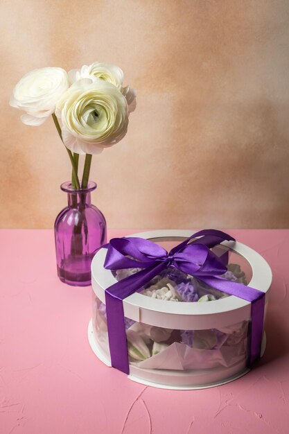 Flowers in a vase and gift box