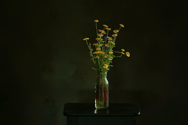 flowers vase still life, seasonal summer inside vintage style, yellow flowers wild