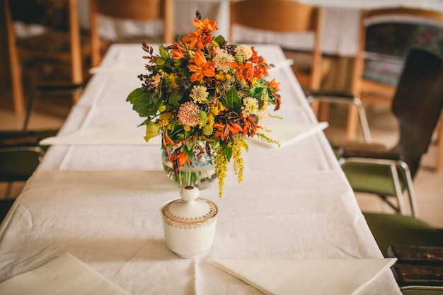 Photo flowers in vase on table