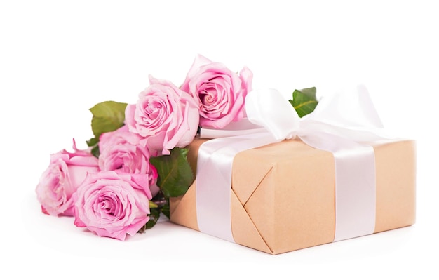 Flowers with clipping path side view Beautiful pink roses on stem with leaves and gift wrapping isolated on white background Natur object for design to Valentines Day mothers day anniversary