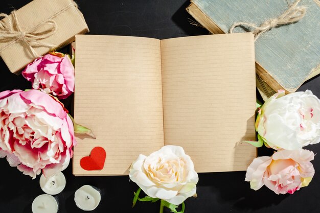 flowers with empty vintage notebook for your design