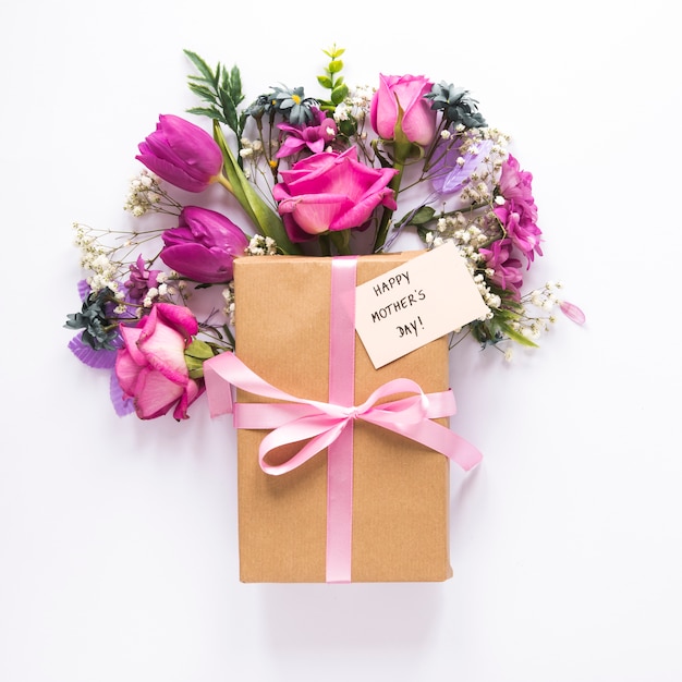 Flowers with gift and Happy Mothers Day inscription 