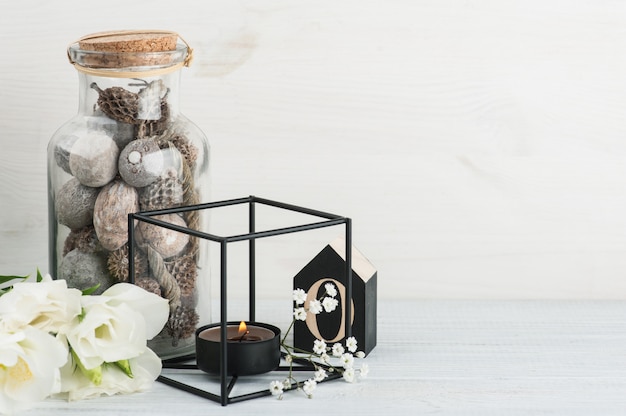 Flowers and wooden letter O on white table