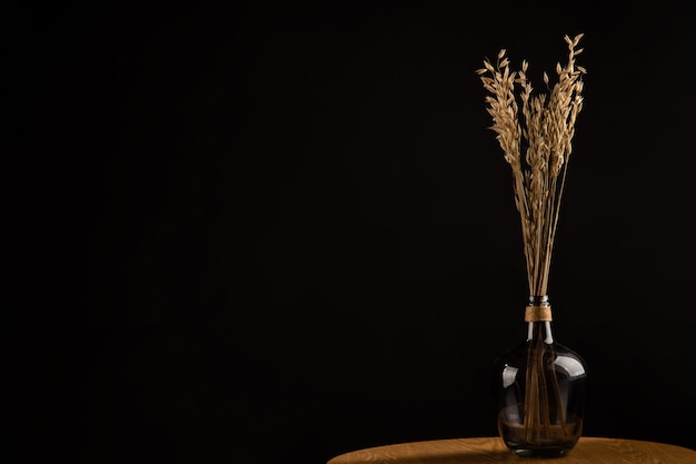 flowers in the wooden table vase