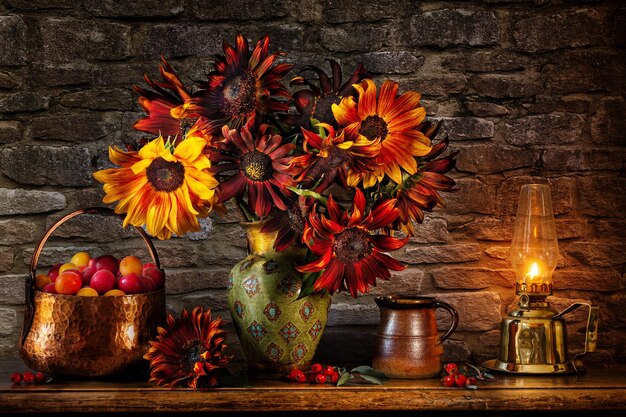 flowers on a wooden table with a fireplace and a candle.