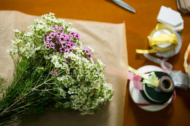 Flowers on the wooden worktop at flower shop