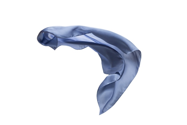 Flowing blue silk scarf isolated on white wall.