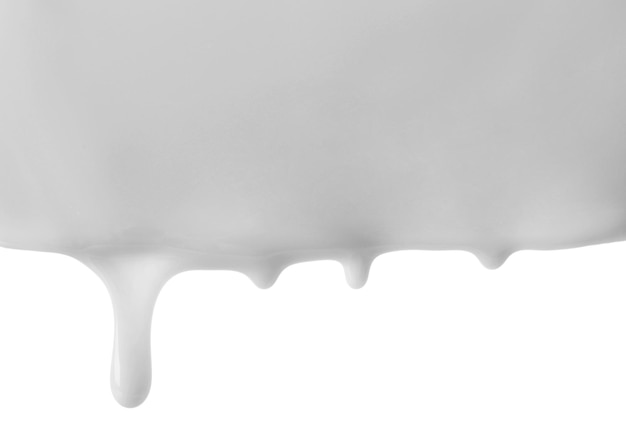 Фото Течет молоко, изолированное на белом