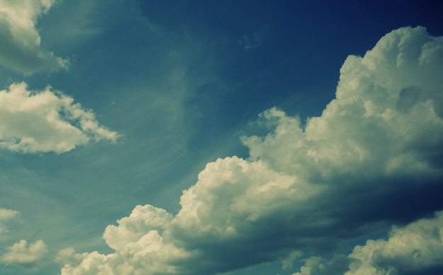  fluffy clouds in the blue sky 