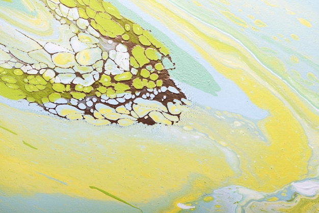 Fluid acrylic painting in green and yellow colors