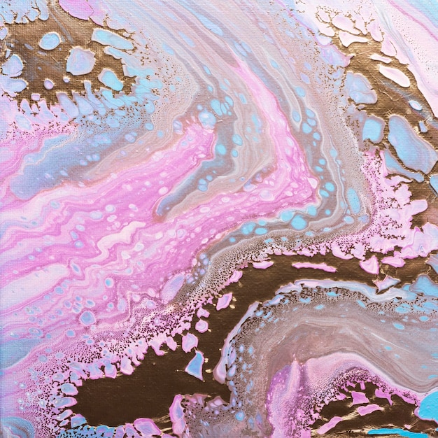 Fluid acrylic painting in pink and gold colors