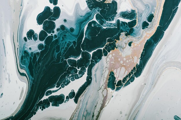 Fluid Art Abstraction from green paint bubbles with inclusion of gold Marble effect background or texture