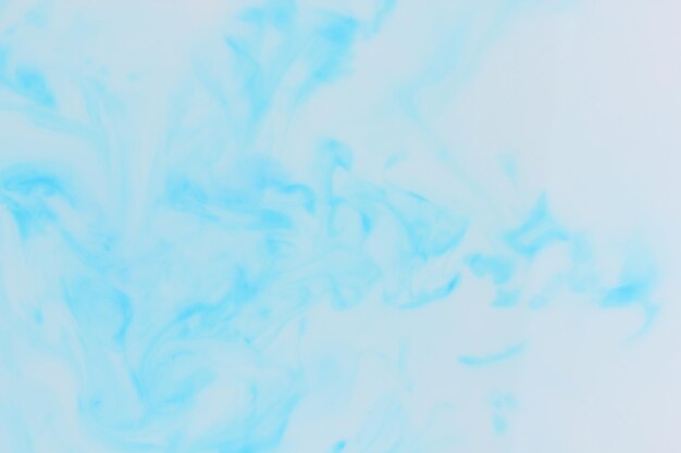 Fluid art Blue stains on a white background Abstract marble texture Liquid color backdrop