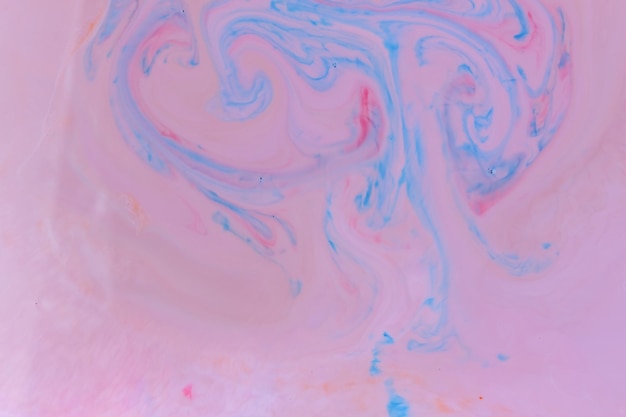 Fluid art Creative multicolored background with abstract painted waves Mixed paints Marble beautiful pattern