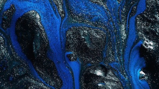 Fluid art glitter paint marble texture blue black