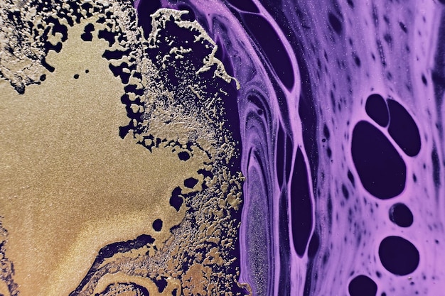 Fluid Art Golden metallic abstraction and purple waves Marble effect background or texture