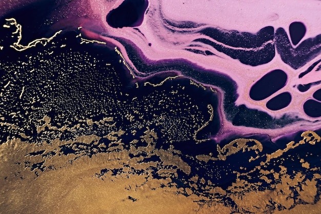 Fluid Art Golden metallic black and pink wriggling waves Marble effect background or texture