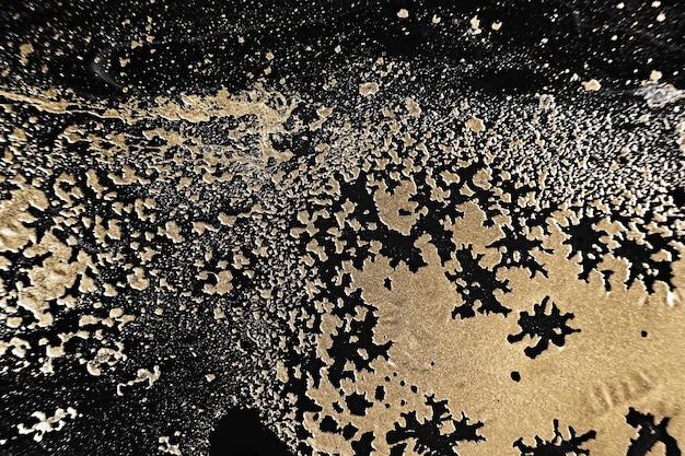 Fluid Art Metallic goud abstracte golven op zwarte achtergrond Marmeren effect achtergrond of textuur