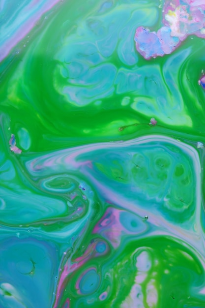 Fluid art Pink green abstract liquid background Colored texture on water Blank for the designer