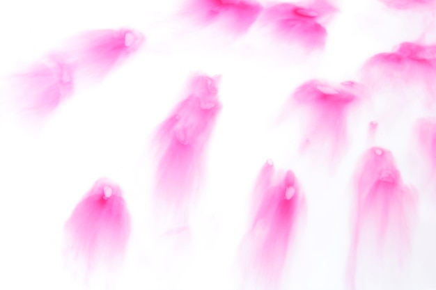 写真 流動的なアート白い背景の上のピンクの斑点ピンク色の斑点のある抽象的な背景