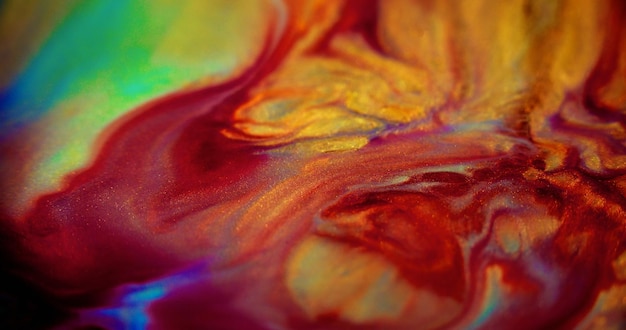 Foto arte fluida scintillante miscela di dolore sfocato rosso giallo viola blu verde colore luccicante particelle d'oro luccicante