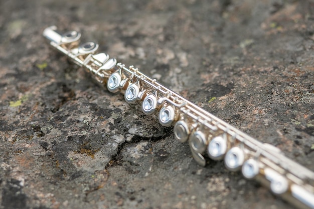 A flute lying on the asphalt track during marching band camp