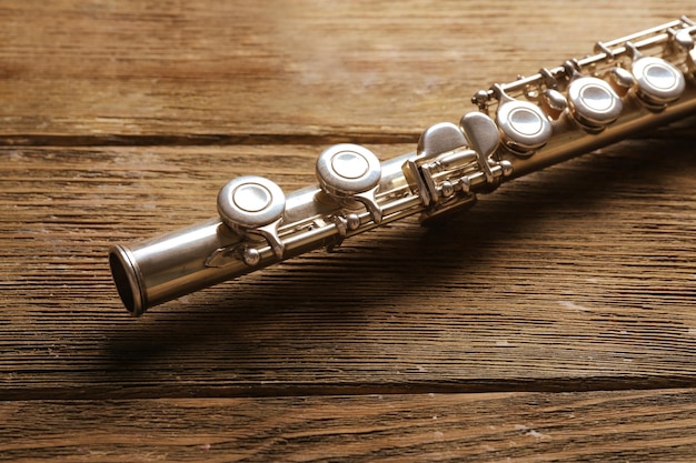 Flute on wooden background