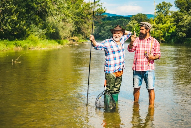 Fly angler on the river fishing in river fishing in river fly fisherman using fly fishing rod in bea...