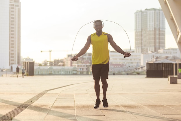 Fly boxer training before competitions holding jump rope