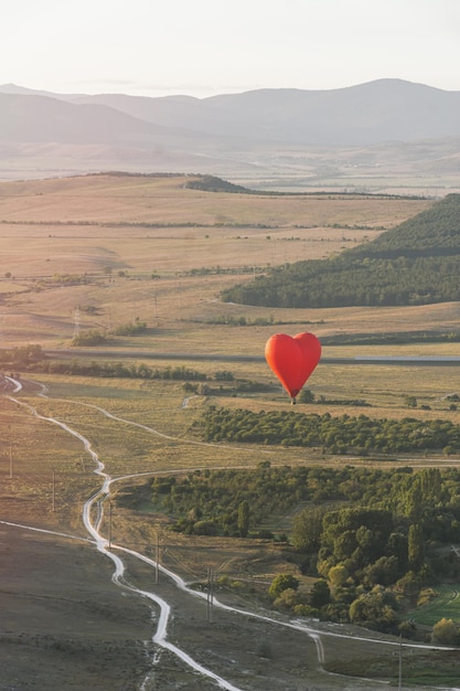 Flying a balloon in the shape of a heart