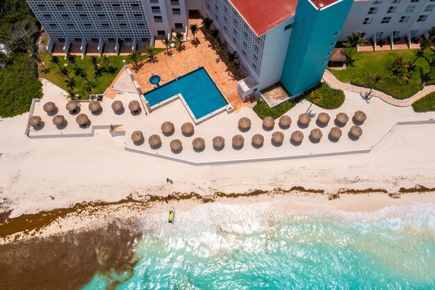 Flying over beautiful Cancun beach area Aerial view of luxury hotels Holidays concept view