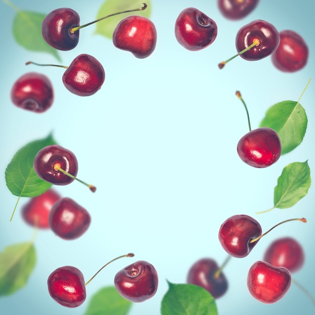 Flying cherries on a blue background