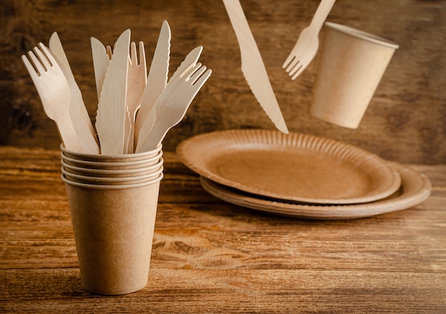 Flying disposable paper tableware . Eco friendly, zero waste. Copy space.