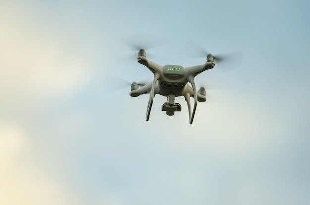 Photo flying drone with camera on the sky