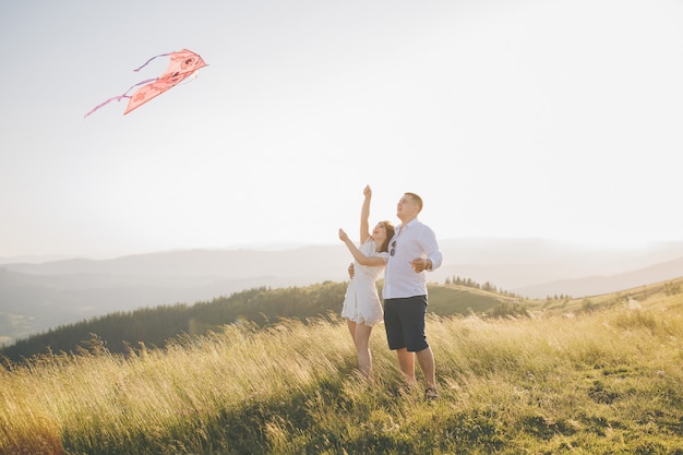 Flying kite in hand. sunny spring day. flying kite have fun on countryside.