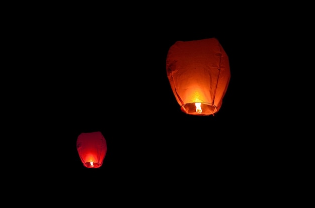 Flying lantern in the dark sky