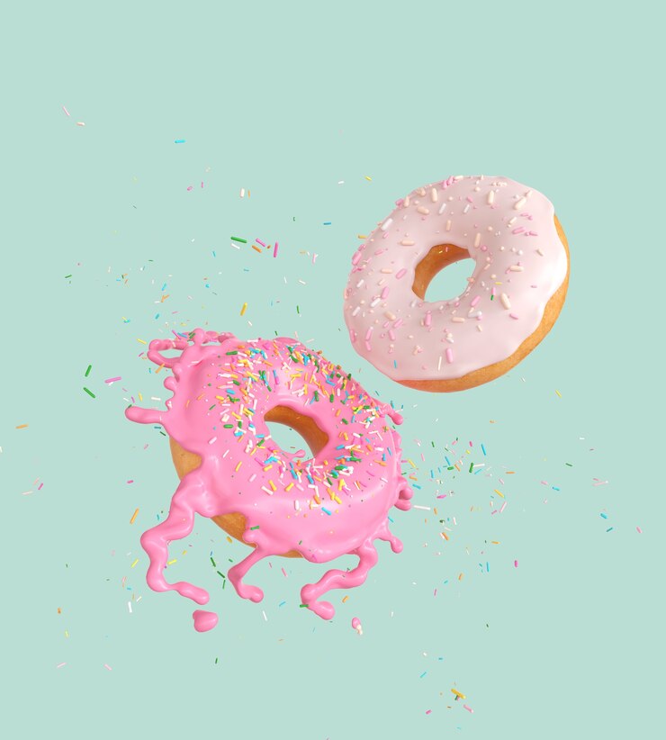 Photo flying pink and white doughnuts and sprinkled