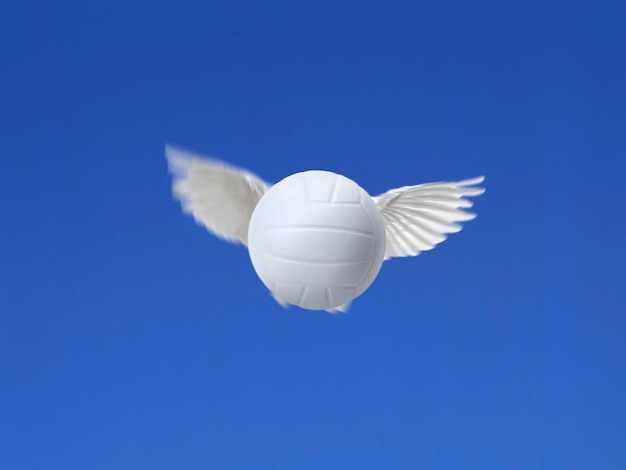 Flying volleyball ball shot in the air with blue sky background