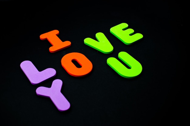 Foam English alphabet letters. I love you with bright letters. 