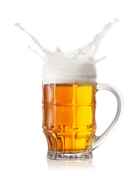 Foam splash in faceted beer mug