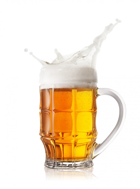 Foam splash in the faceted beer mug