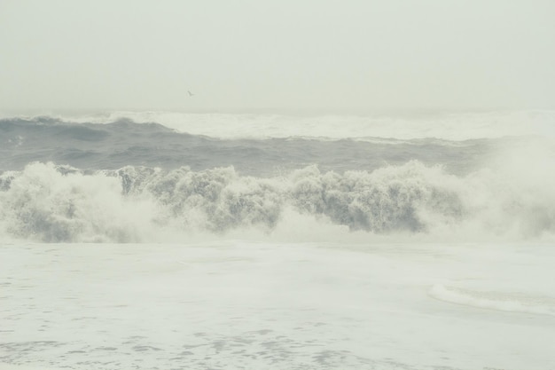 Foamy waves on storm landscape photo