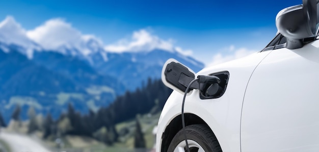 Focus closeup ev car and charger with cordial blur background